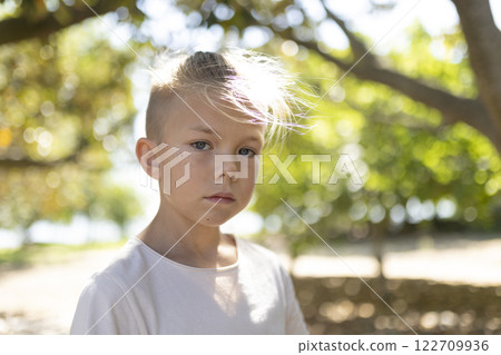 Young boy enjoying a sunny day outdoors Young boy enjoying a sunny day outdoors 122709936