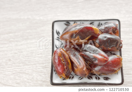 Close up photo of dried dates, selective focus. Close up photo of dried dates, selective focus. 122710530