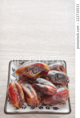 Close up photo of dried dates, selective focus. Close up photo of dried dates, selective focus. 122710531