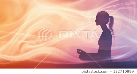 Silhouette of a woman meditating 122710999