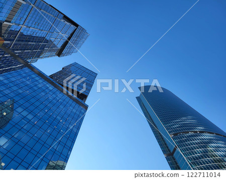 Moscow, Russia, 09:10, 2024 Background of modern architecture. The Federation skyscrapers in the Moscow City business district rise against the blue sky Moscow, Russia, 09:10, 2024 Background of modern architecture. The Federation skyscrapers in the Moscow City business district rise against the blue sky 122711014