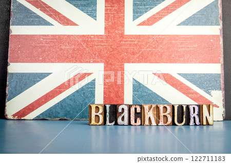 BLACKBURN. Urban Area in Great Britain. Flag and alphabet letters on wooden texture background BLACKBURN. Urban Area in Great Britain. Flag and alphabet letters on wooden texture background 122711183