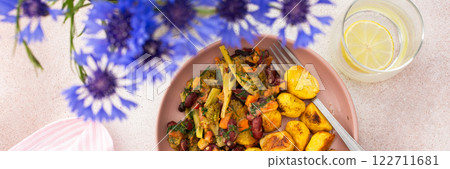 Stewed potatoes with stewed vegetables, broccoli and beans with carrots and herbs Stewed potatoes with stewed vegetables, broccoli and beans with carrots and herbs 122711681