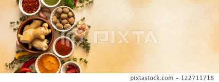 A warm display of spices and herbs on a beige background, each adding rich aromas and flavors, perfect for enhancing recipes, banner A warm display of spices and herbs on a beige background, each adding rich aromas and flavors, perfect for enhancing recipes, banner 122711718