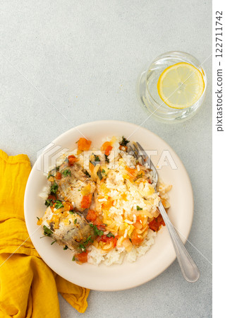 White rice with baked vegetables and baked white pollock fish White rice with baked vegetables and baked white pollock fish 122711742