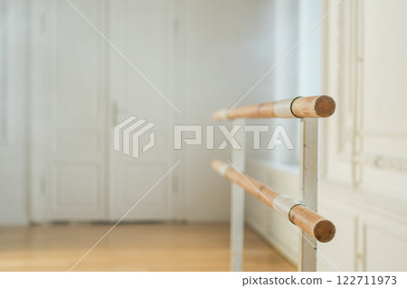 Empty ballet dance studio with barre. Professional ballet barre for stretching practicing dancing positions in dance school Dance hall ready for ballet class training. Ballet school 122711973