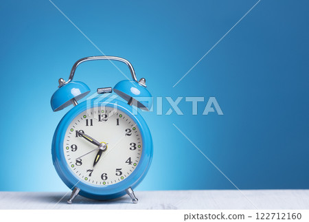 Alarm Clock on blue background 122712160