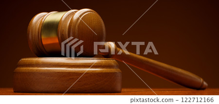 Wooden gavel on brown background 122712166