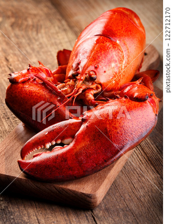 Boiled lobster on wooden background Boiled lobster on wooden background 122712170