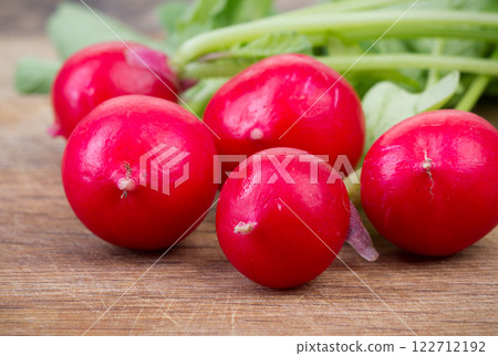 Fresh red radish and kitchen board Fresh red radish and kitchen board 122712192