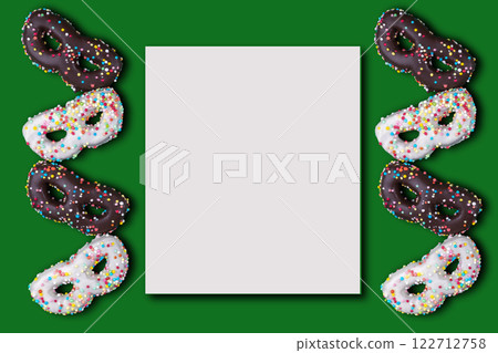 Flat lay of greeting card for carnival or birthday with cookies in the shape of a mask and mock up. Flat lay of greeting card for carnival or birthday with cookies in the shape of a mask and mock up. 122712758