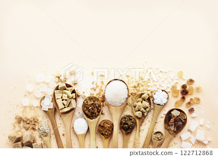 Mix of sugar varieties: unbleached, brown and white, refined and unrefined, granulated and cubes Mix of sugar varieties: unbleached, brown and white, refined and unrefined, granulated and cubes 122712868