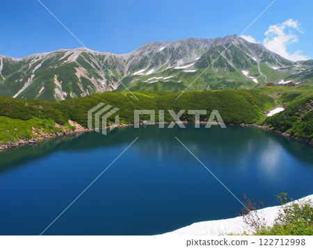 Summer drilling pond and Tateyama mountain range 122712998