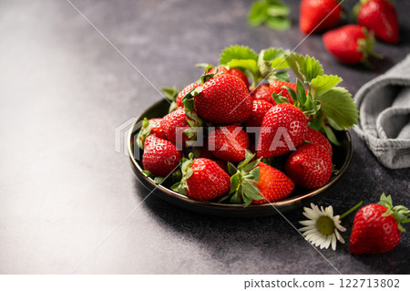 Red ripe strawberries berries. Dark background 122713802