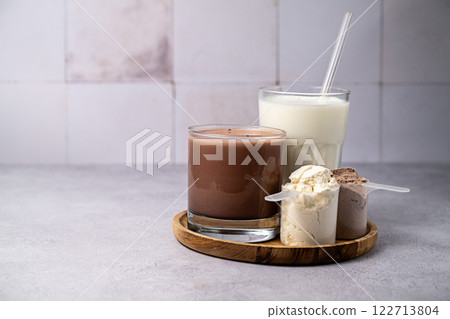 Protein powder and protein drinks, with scoops. Food supplement, bodybuilding, fitness and sport 122713804