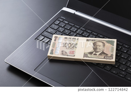 Laptop computer and money 122714842