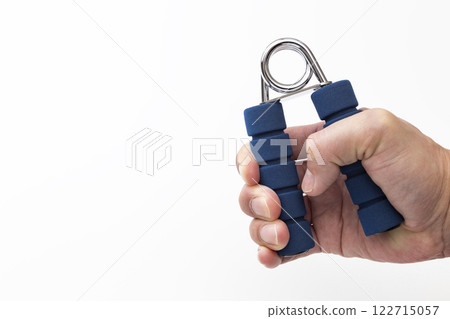 Male hands doing grip training 122715057