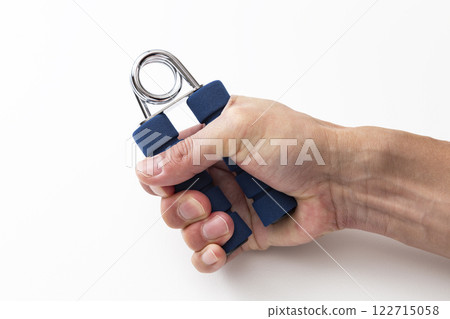 Male hands doing grip training 122715058