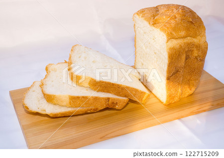 Fresh homemade bread on wooden cutting board. Fresh homemade bread on wooden cutting board. 122715209