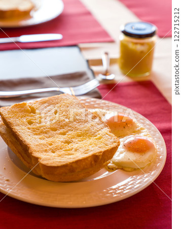 Fresh homemade bread with eggs on white plate. Home Breakfast. Fresh homemade bread with eggs on white plate. Home Breakfast. 122715212