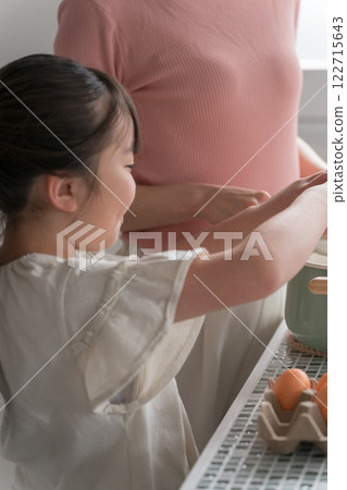 Mom and her 9 year old daughter 122715643