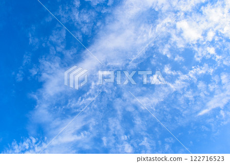 beautiful blue sky and white fluffy group of clouds with sunrise in the morning, natural background beautiful blue sky and white fluffy group of clouds with sunrise in the morning, natural background 122716523