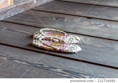 Image of straw sandals between the wooden boards in a curved room from the Edo period Image of straw sandals between the wooden boards in a curved room from the Edo period 122716880