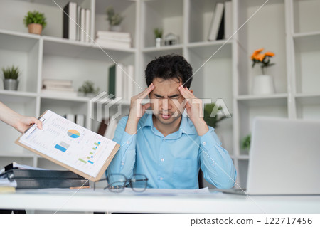 Tired after hard work overwhelmed businessman in office stressful environment focused on struggles 122717456