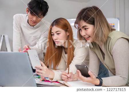 Creative team of designers in application design and ux ui usability planning. Modern business team teamwork. Creative team of designers in application design and ux ui usability planning. Modern business team teamwork. 122717815