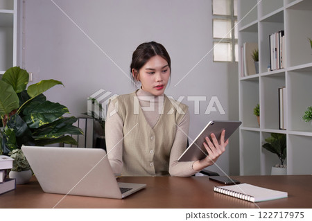 Asian female student studying online Video calls through Zoom about business administration and accounting subjects attentively Asian female student studying online Video calls through Zoom about business administration and accounting subjects attentively 122717975
