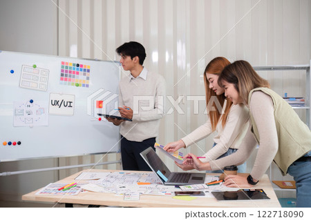 Creative designer team leader presentation on application design and ux ui usability planning. Modern business team teamwork. Creative designer team leader presentation on application design and ux ui usability planning. Modern business team teamwork. 122718090