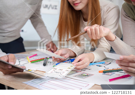 Creative designer team meeting on application design and ux ui usability planning. business team teamwork. Creative designer team meeting on application design and ux ui usability planning. business team teamwork. 122718131