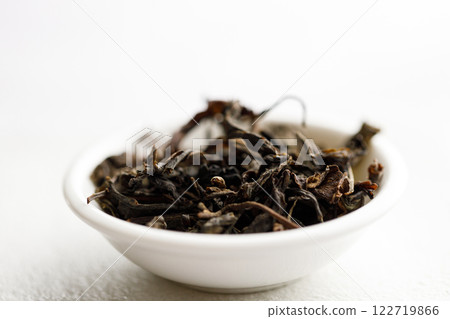 Japanese or Chinese tea leaf on white background. 122719866