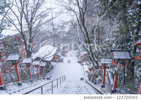 Winter at Kurama Temple: Stone steps and lanterns along the winding approach to the temple Winter at Kurama Temple: Stone steps and lanterns along the winding approach to the temple 122720265