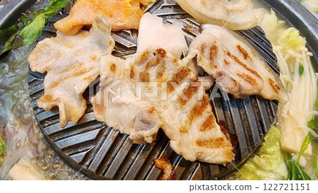 Grilled Meat on Unique Grill Plate with Vegetables and Soup Base 122721151