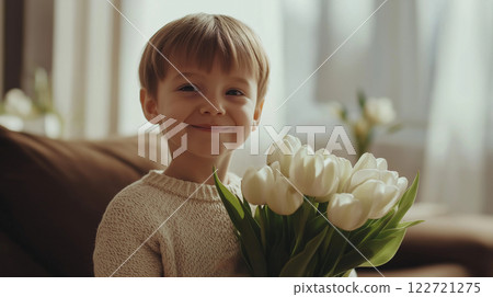 Smiling child holding white tulips for International Woman's Day 122721275