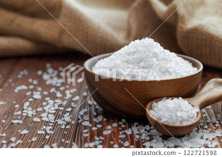 sea salt in bowl and in spoon on table with burlap on the background 122721598