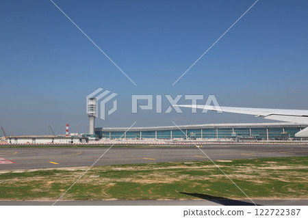 Airport Airfield with Runway, and Airplane Wing at HK Dec 3 2024 Airport Airfield with Runway, and Airplane Wing at HK Dec 3 2024 122722387