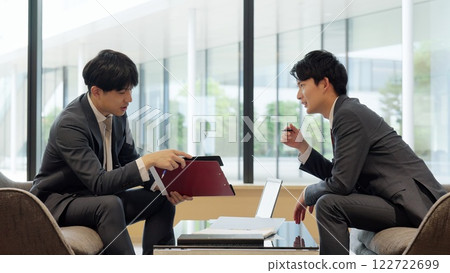 Businessmen arguing at a meeting Businessmen arguing at a meeting 122722699