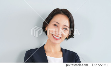 Smiling female business person Smiling female business person 122722962