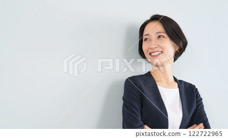 Smiling female business person Smiling female business person 122722965