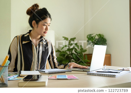 Young designer working on color palette. Young designer working on color palette. 122723789