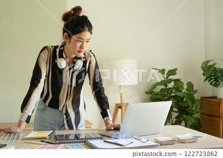 Young designer working on color palette. Young designer working on color palette. 122723862