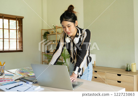 Young designer working on color palette. Young designer working on color palette. 122723863