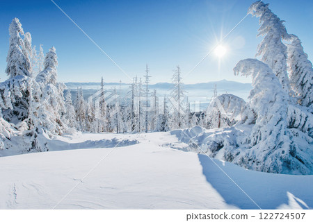 Fantastic winter landscape. Magic sunset in the mountains a frosty day. On the eve of the holiday. The dramatic scene. Carpathian, Ukraine, Europe. Fantastic winter landscape. Magic sunset in the mountains a frosty day. On the eve of the holiday. The dramatic scene. Carpathian, Ukraine, Europe. 122724507