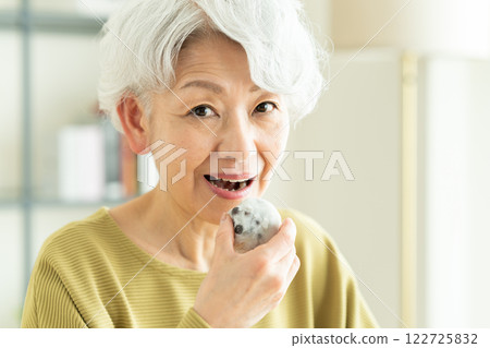 Senior woman eating Daifuku Senior woman eating Daifuku 122725832
