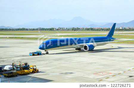 Aircraft are pushed back to the taxiway by airplane tugs, with one in ground handling services. 122726271