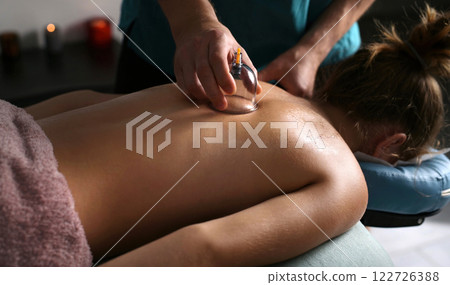 Cupping Therapy In A Spa Salon For Young Girl Cupping Therapy In A Massage Spa Salon For Young Girl Cupping Therapy In A Spa Salon For Young Girl Cupping Therapy In A Massage Spa Salon For Young Girl 122726388