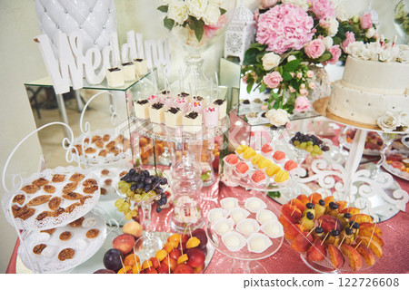 Delicious sweets on candy buffet Delicious sweets on candy buffet 122726608