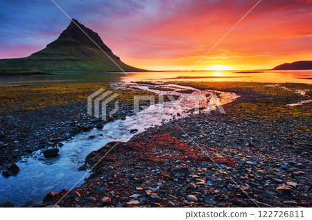 The picturesque sunset over landscapes and waterfalls. Kirkjufell mountain,Iceland 122726811